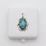 nishapur turquoise 74.90ct pendant in silver setting on a white box