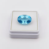 swiss blue topaz round stone 29.05ct Blue gemstone in a white box on a light gray background