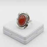 natural red agate carnelian aqeeq 33.65ct Silver ring with a red stone on a white background