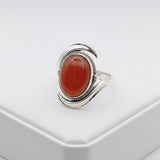 natural red agate carnelian aqeeq 31.15ct Silver ring with a red stone on a white background