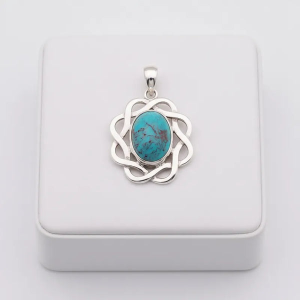nishapur terquoise 41.10ct  pendant with silver setting on a white box