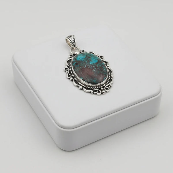 nishapur turquoise stone 60.00ct pendant on a silver chain in a white box
