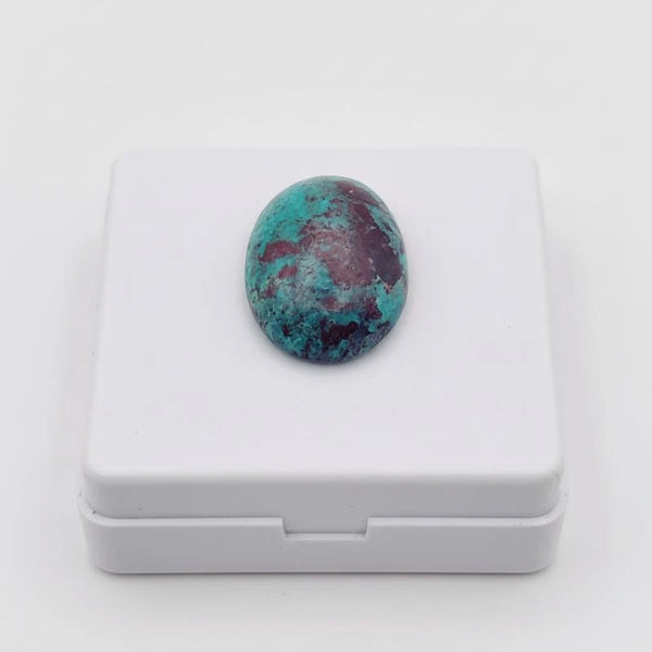 nishapur turquoise 61.55ct stone on a white box with a white background