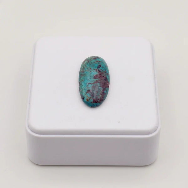 nishapur turquoise 41.70ct stone on a white box with a white background