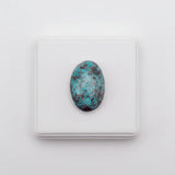 nishapur turquoise 74.90ct stone on a white background