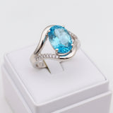 swiss blue topaz round stone 29.05ct Silver ring with a blue gemstone on a white box